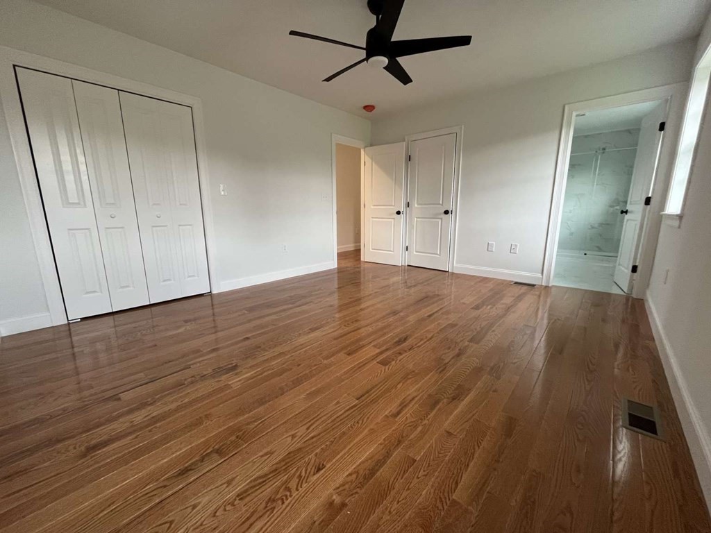 107 Putnam Hill Road Sutton, MA 01590 - Photo 6 of 21 a view of empty room with wooden floor