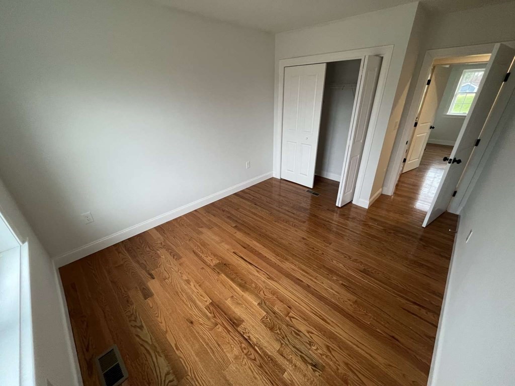 107 Putnam Hill Road Sutton, MA 01590 - Photo 9 of 21 a view of empty room with wooden floor