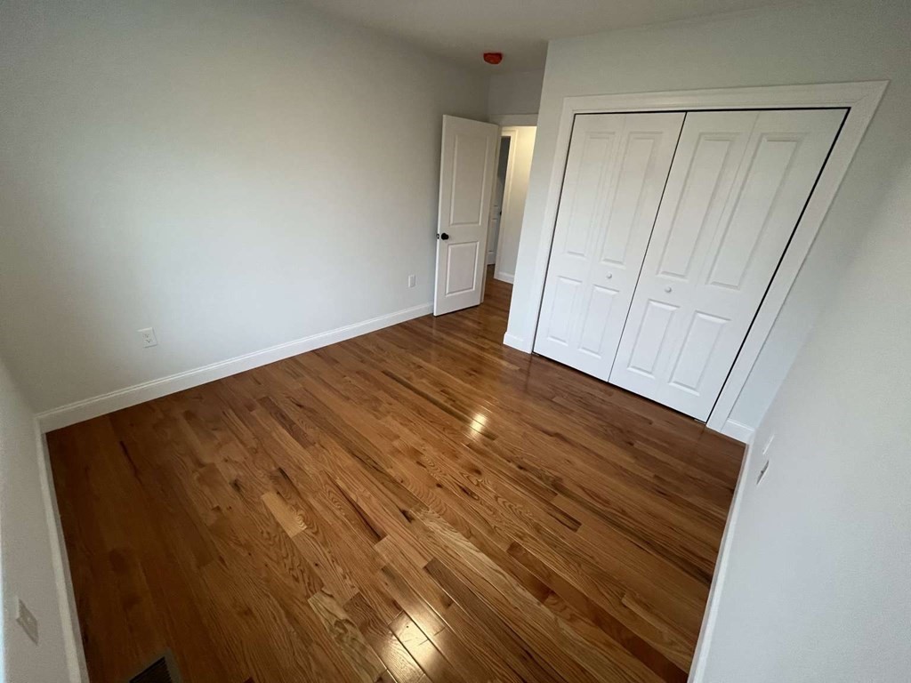 107 Putnam Hill Road Sutton, MA 01590 - Photo 10 of 21 a view of empty room with wooden floor