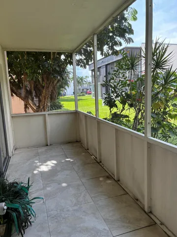 a view of a back yard from a balcony