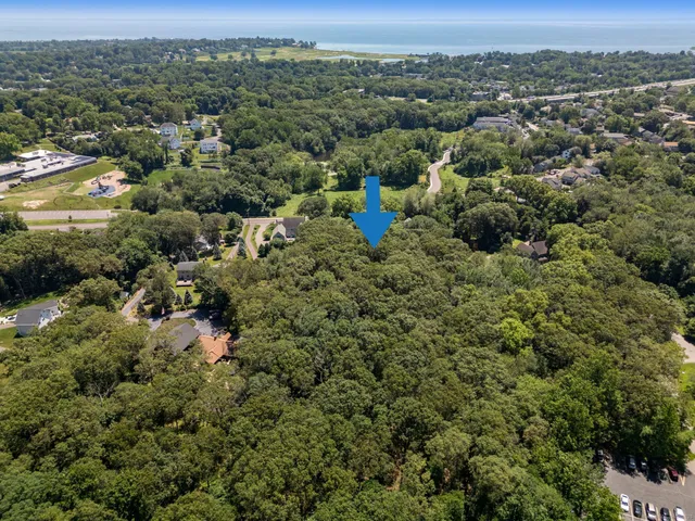 an aerial view of a houses with a yard