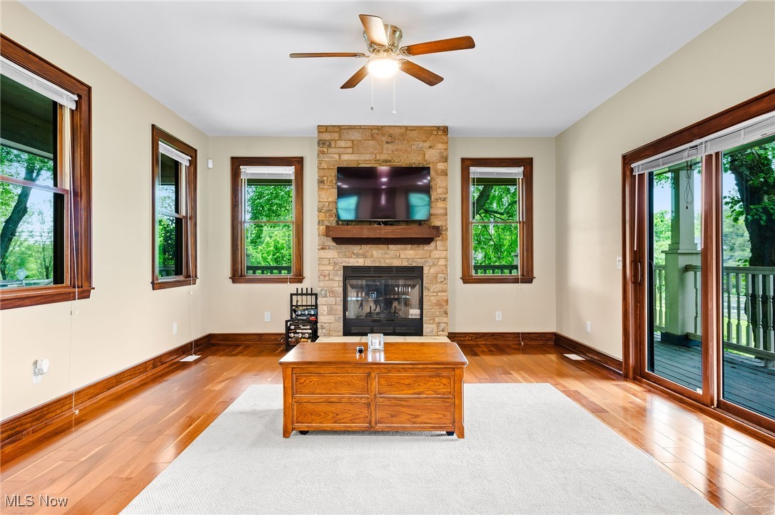 1238 Ridge Road Hinckley, OH 44233 - Photo 4 of 42 Living room featuring plenty of natural light, hardwood / wood-style floors, ceiling fan, and baseboards