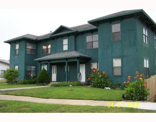 1224 2nd Street Corpus Christi, TX 78404 - Photo 1 of 8 a front view of a house with a garden