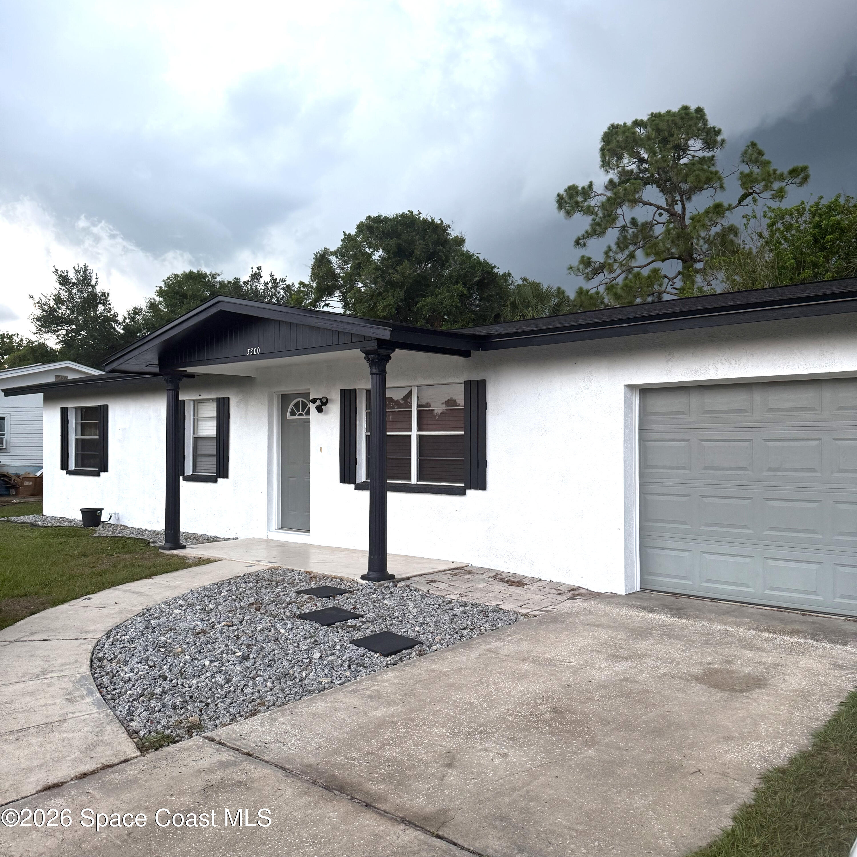 3300 Argyle Road Titusville, FL 32796 - Photo 3 of 29 front view of a house with a yard