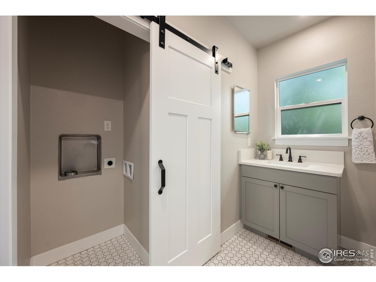 217 Locust Street Windsor, CO 80550 - Photo 21 of 40 a bathroom with a sink and mirror
