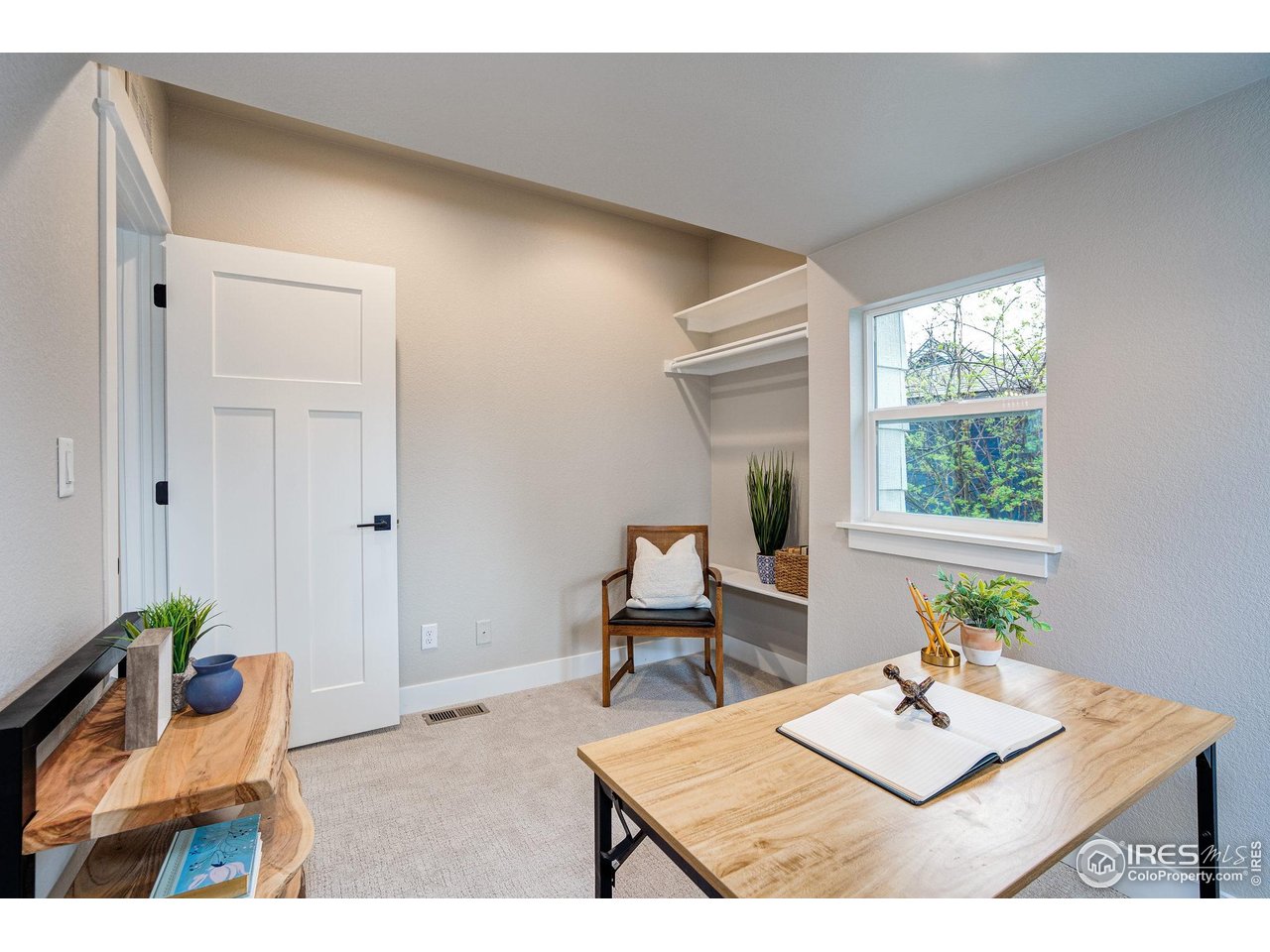 217 Locust Street Windsor, CO 80550 - Photo 24 of 40 a living room with furniture and a window