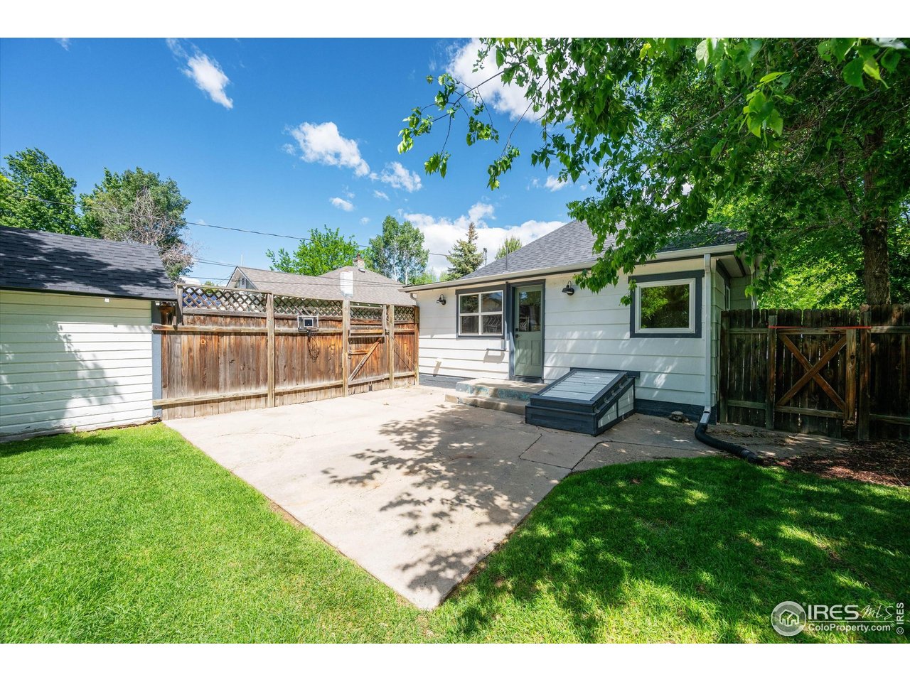 217 Locust Street Windsor, CO 80550 - Photo 27 of 40 a view of a house with backyard and sitting area