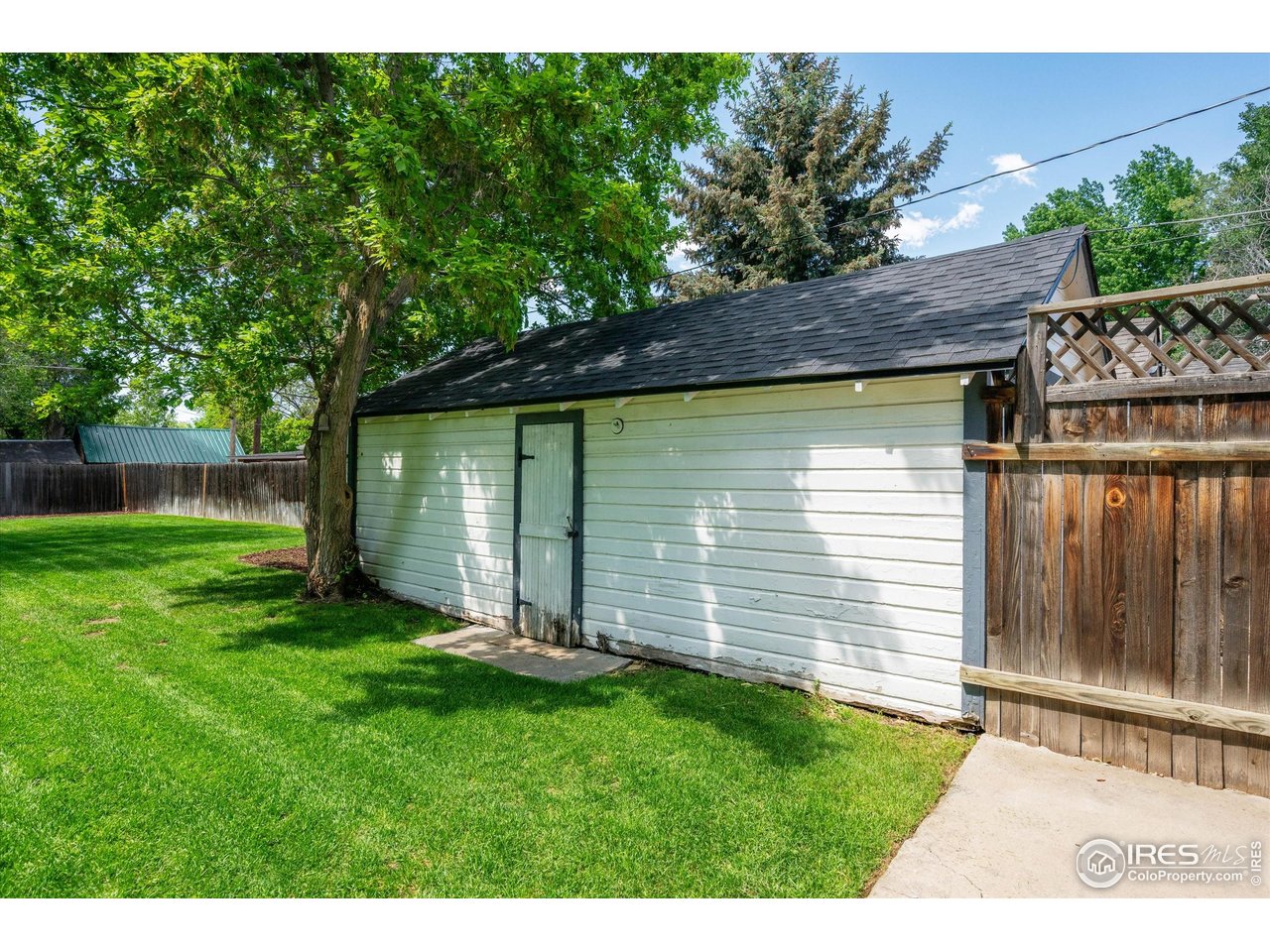 217 Locust Street Windsor, CO 80550 - Photo 30 of 40 a front view of house with yard