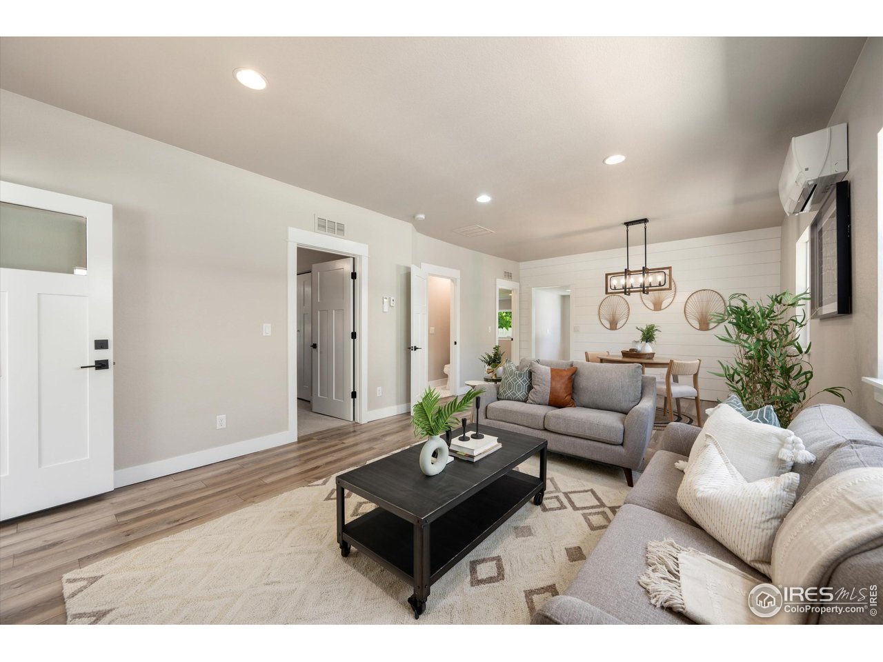 217 Locust Street Windsor, CO 80550 - Photo 3 of 40 a living room with furniture and wooden floor