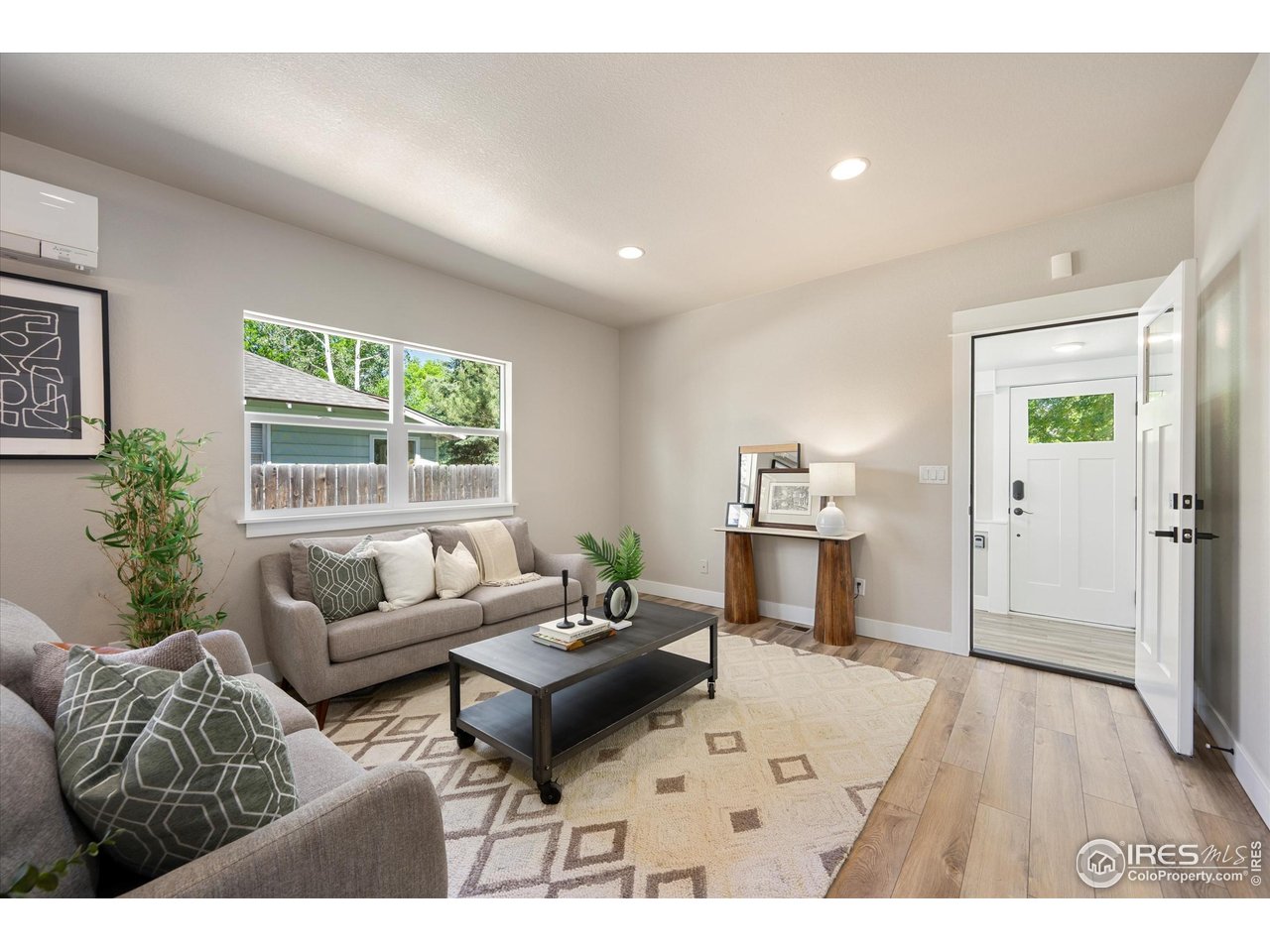 217 Locust Street Windsor, CO 80550 - Photo 6 of 40 a living room with furniture and a window