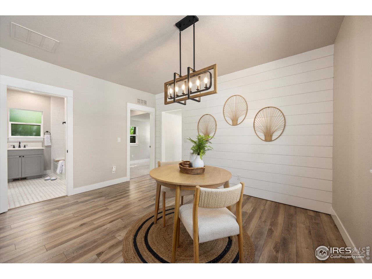 217 Locust Street Windsor, CO 80550 - Photo 8 of 40 a view of a dining room with furniture and wooden floor