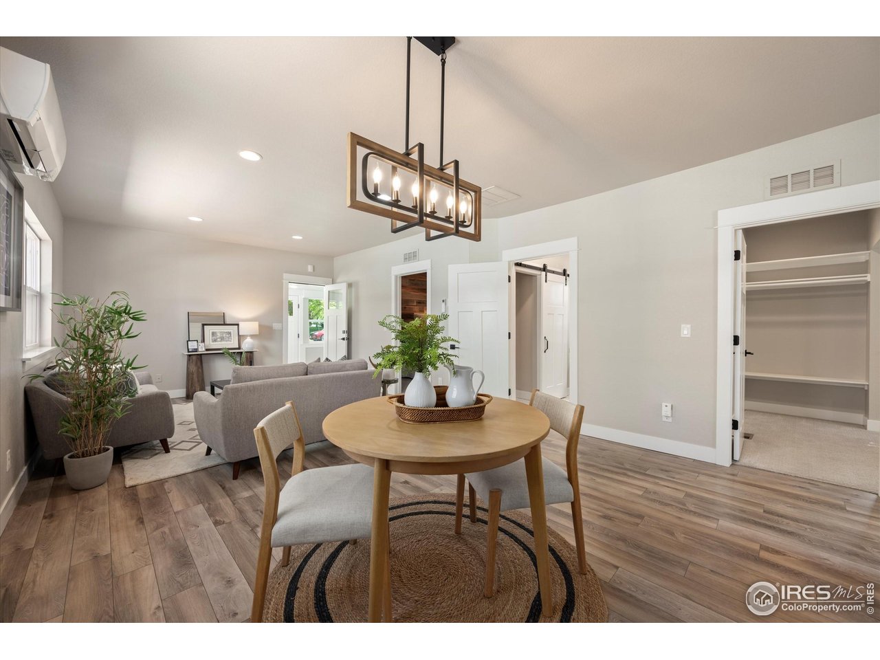 217 Locust Street Windsor, CO 80550 - Photo 10 of 40 a view of a dining room with furniture and wooden floor