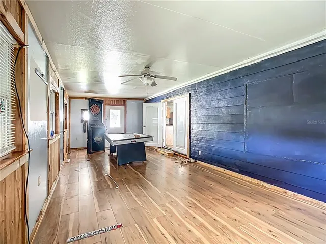 a view of kitchen with furniture and wooden floor
