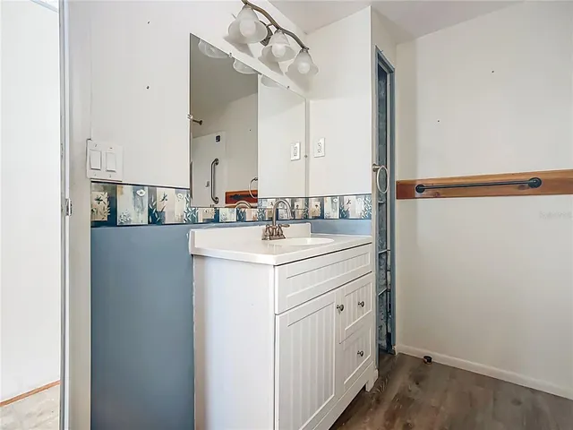 a bathroom with a sink and a mirror