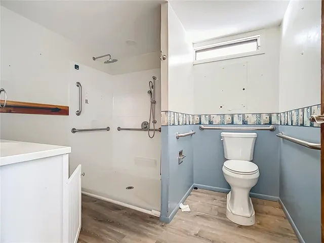 a bathroom with a toilet and a sink
