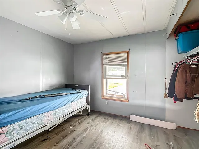 a view of room with window and wooden floor