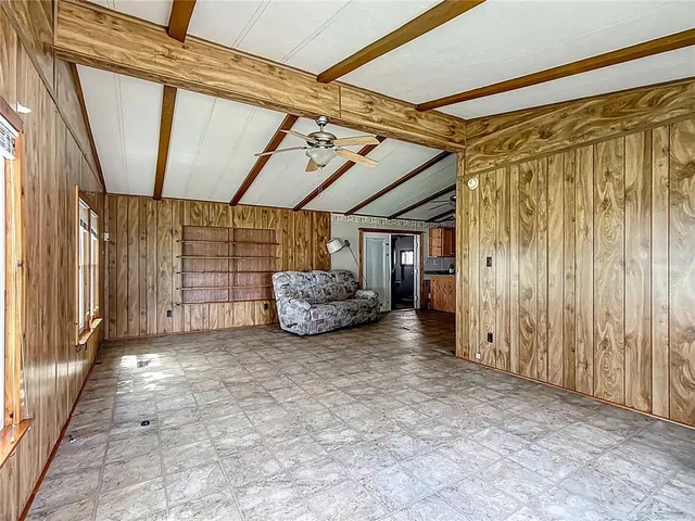 a view of a room with wooden walls