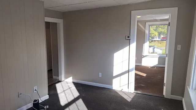 a view of an entryway with wooden floor