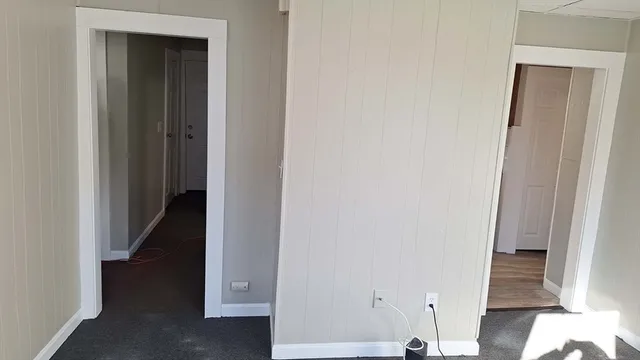 a view of a hallway with the door