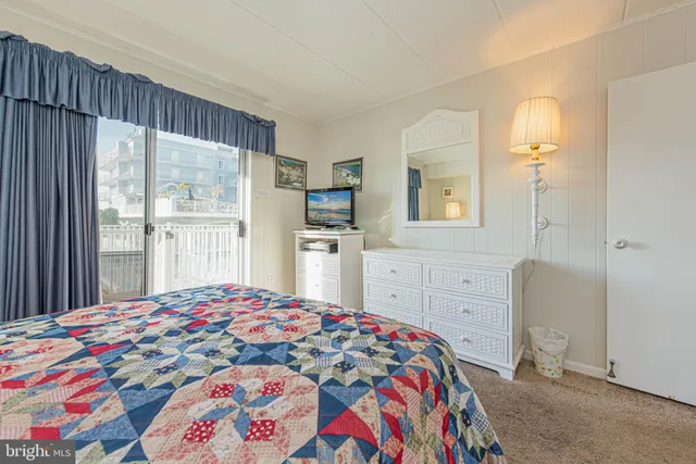 a bedroom with a bed and dresser