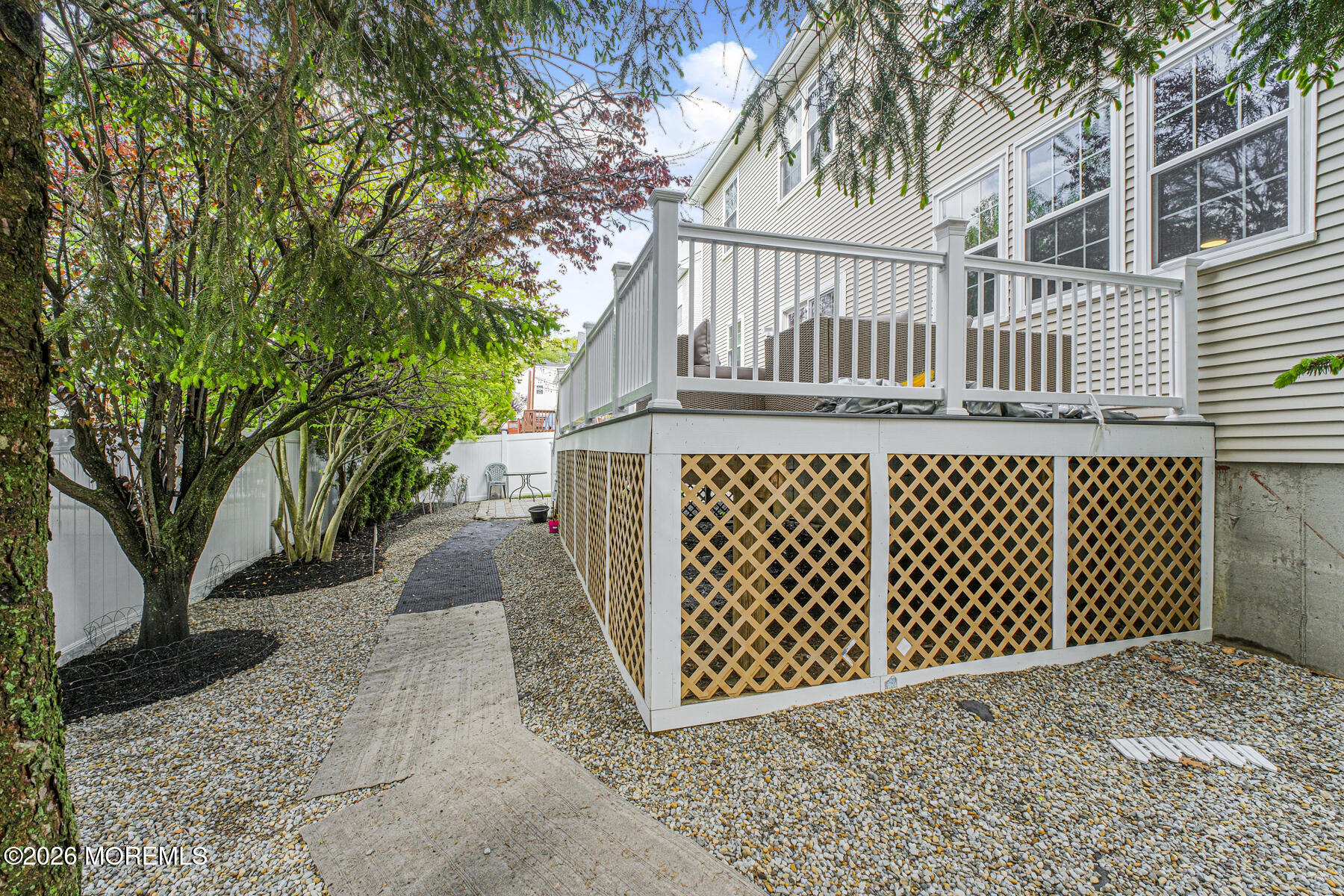 315 Wedgewood Road Morganville, NJ 07751 - Photo 36 of 37 a street view with a wooden fence