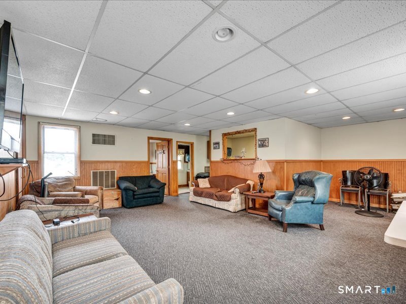 61 Maple Avenue Wallingford, CT 06492 - Photo 6 of 20 a living room with furniture and a couch