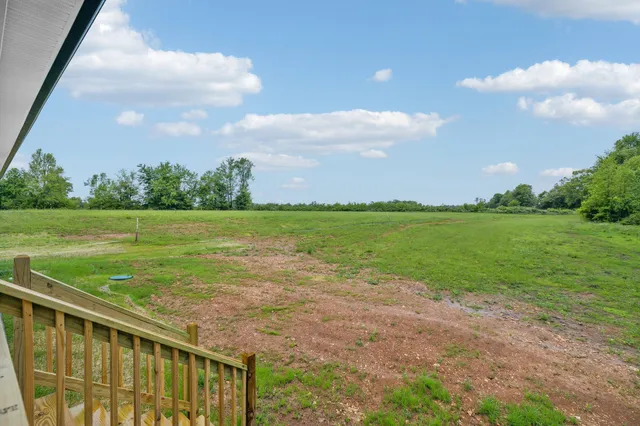 a view of a garden and an ocean