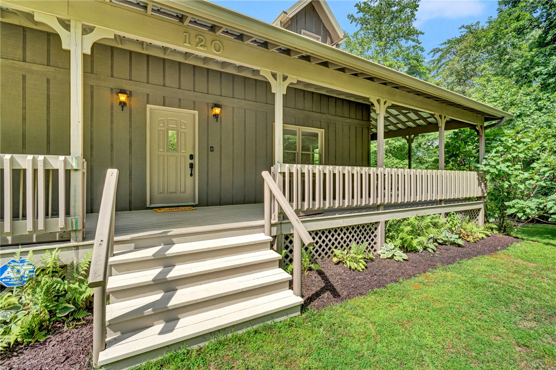 120 Patterson Ridge Road Salem, SC 29676 - Photo 3 of 46 A charming wooden house with a welcoming front porch and mature landscaping.