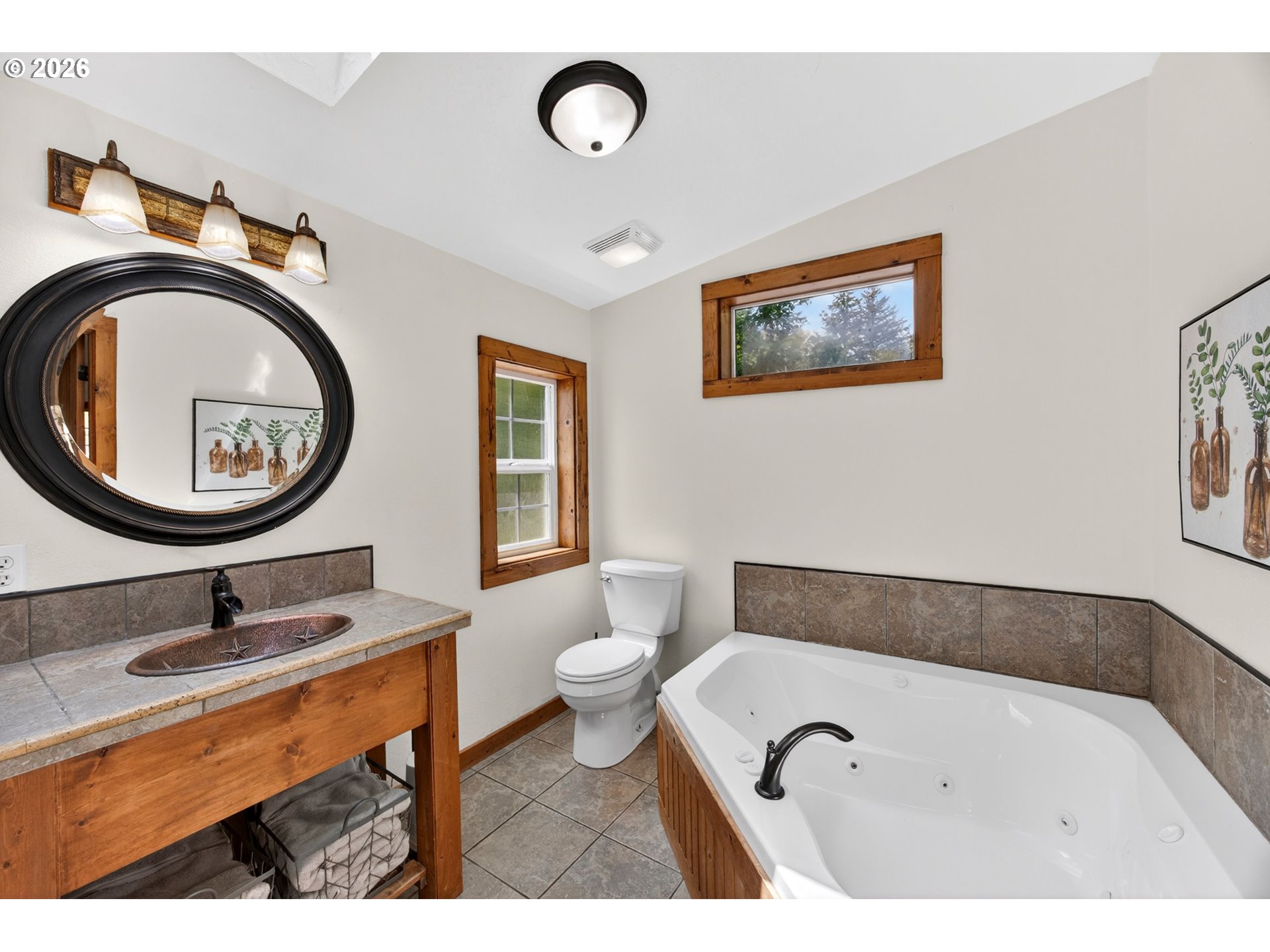 6895 Canary Road Westlake, OR 97493 - Photo 18 of 40 a bathroom with a sink and a mirror