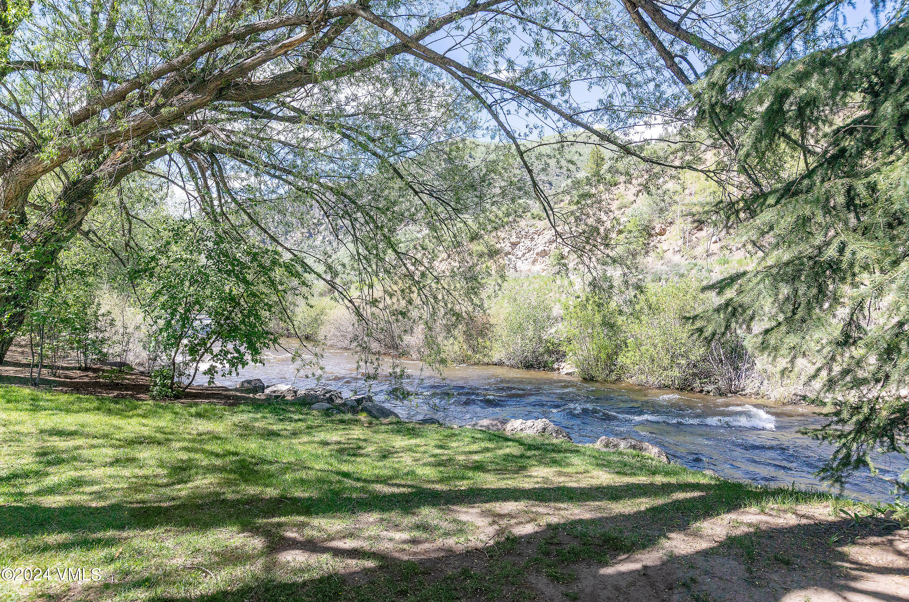 192 Main Street Minturn, CO 81645 - Photo 7 of 11 a view of a yard with an tree