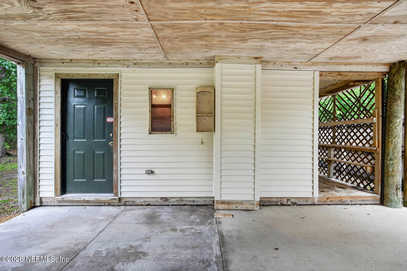 1950 Lightsey Road St. Augustine, FL 32084 - Photo 30 of 57 a view of a door and a window