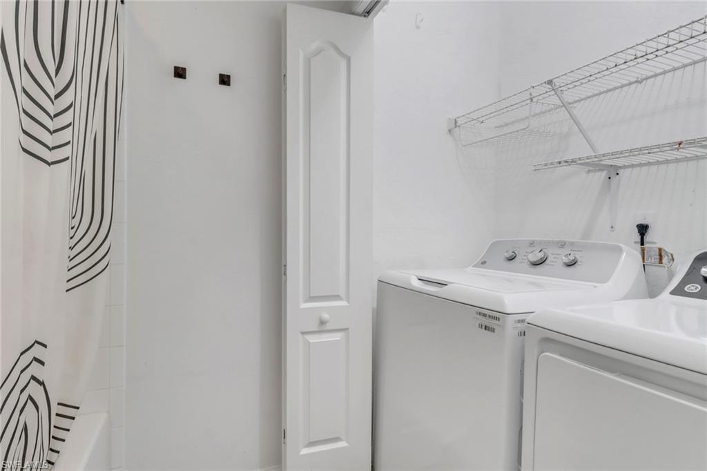 8550 Kingbird Loop, Unit 625 Estero, FL 33967 - Photo 12 of 16 a utility room with dryer and washer