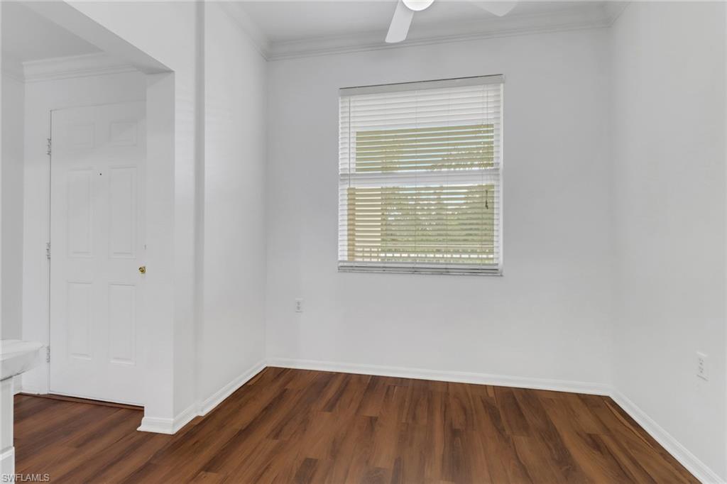 8550 Kingbird Loop, Unit 625 Estero, FL 33967 - Photo 3 of 16 an empty room with wooden floor and windows