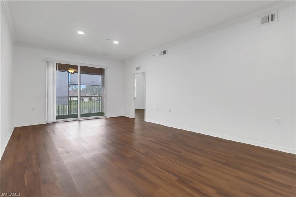 8550 Kingbird Loop, Unit 625 Estero, FL 33967 - Photo 6 of 16 a view of wooden floor and windows in a room
