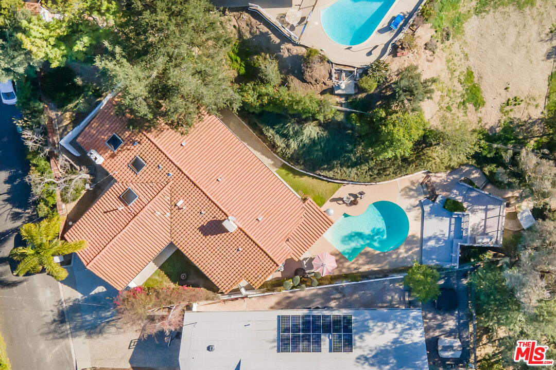 4831 Rosa Road Woodland Hills, CA 91364 - Photo 23 of 27 an aerial view of a house with a yard and garden