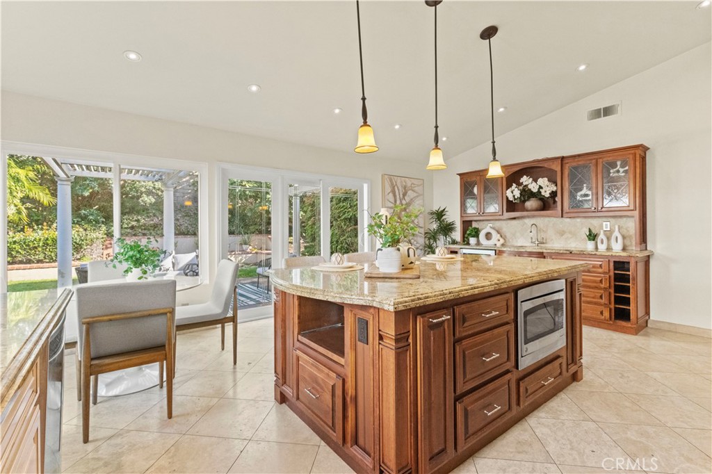 13 Grant Irvine, CA 92620 - Photo 14 of 27 a kitchen with a stove and a wooden floor