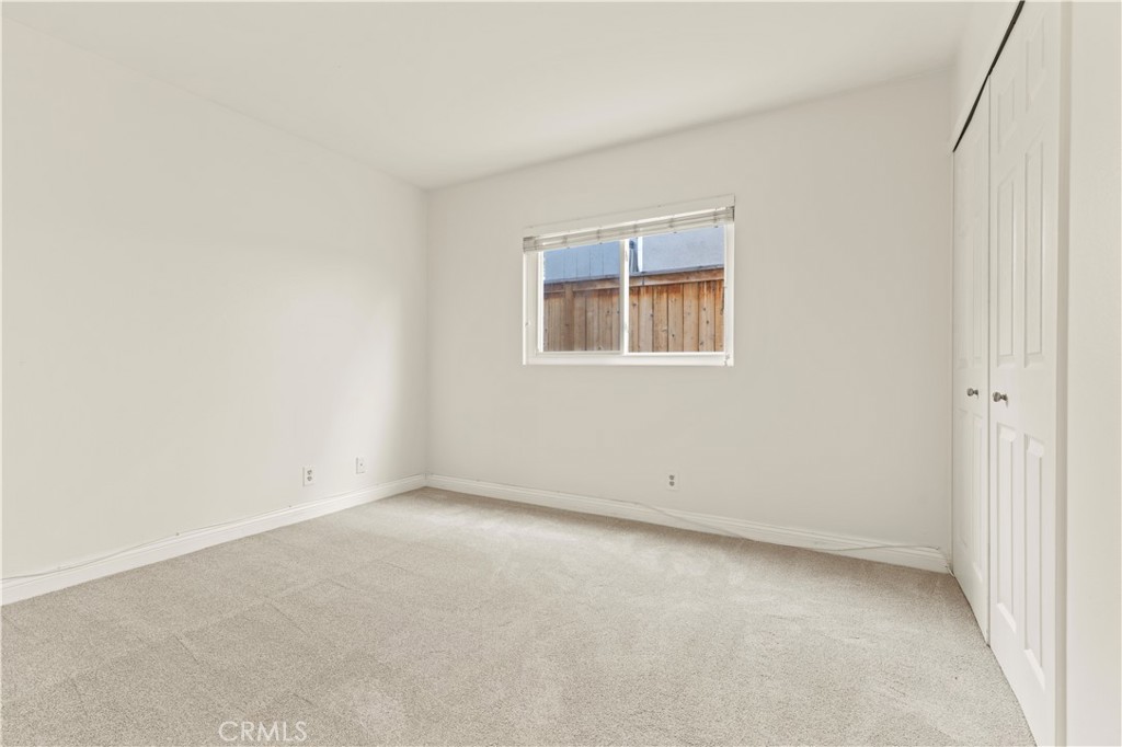 13 Grant Irvine, CA 92620 - Photo 19 of 27 an empty room with a exposed radiator and a window