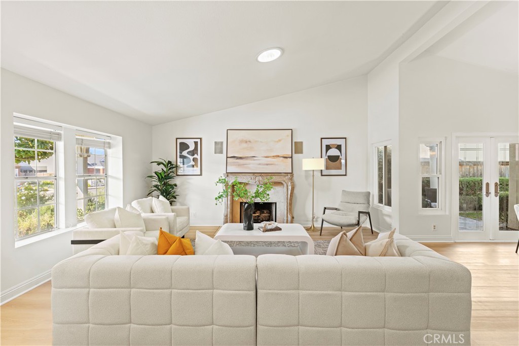 13 Grant Irvine, CA 92620 - Photo 3 of 27 a living room with fireplace furniture and a large window