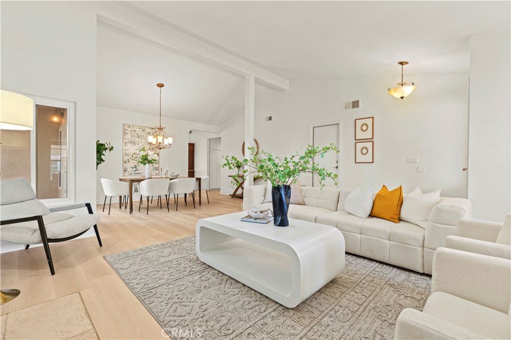 13 Grant Irvine, CA 92620 - Photo 6 of 27 a living room with furniture and a chandelier