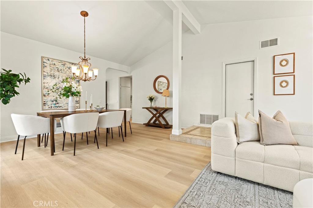 13 Grant Irvine, CA 92620 - Photo 10 of 27 a living room with furniture and a chandelier