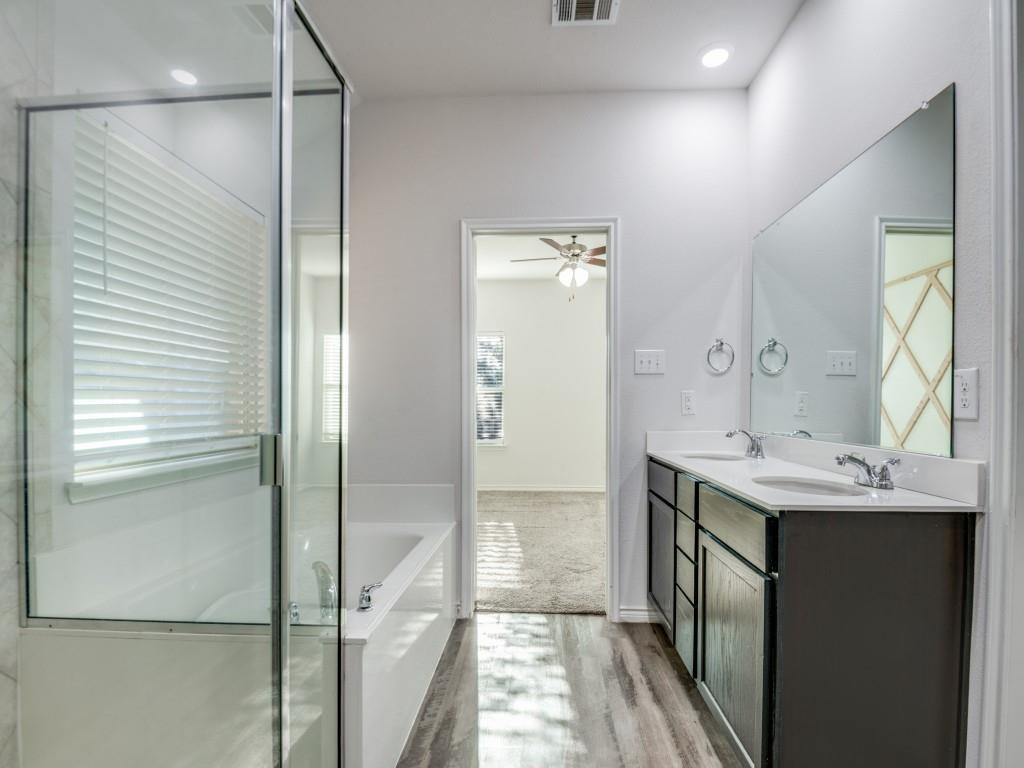 2804 Lenham Lane Forney, TX 75126 - Photo 11 of 12 a bathroom with a sink and mirror
