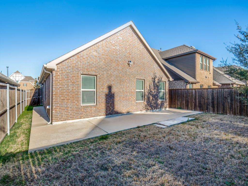 2804 Lenham Lane Forney, TX 75126 - Photo 12 of 12 a view of a house with a yard and wooden fence