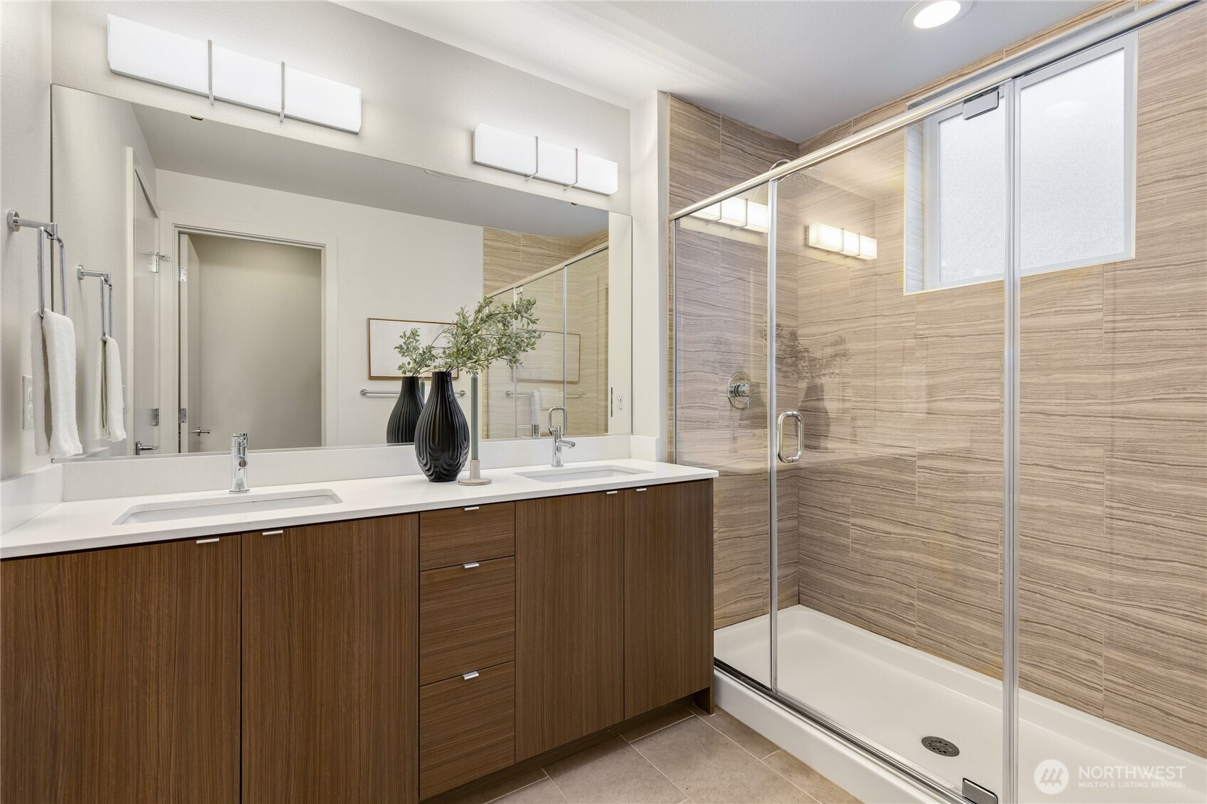 4272 Southwest Bradford Street Seattle, WA 98116 - Photo 23 of 28 a bathroom with a double vanity sink and mirror