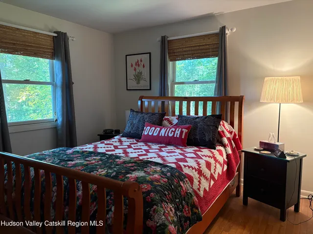 a bedroom with a bed and a table