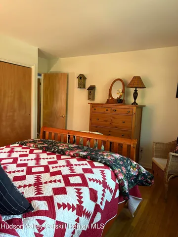 a bed sitting in a room next to a window