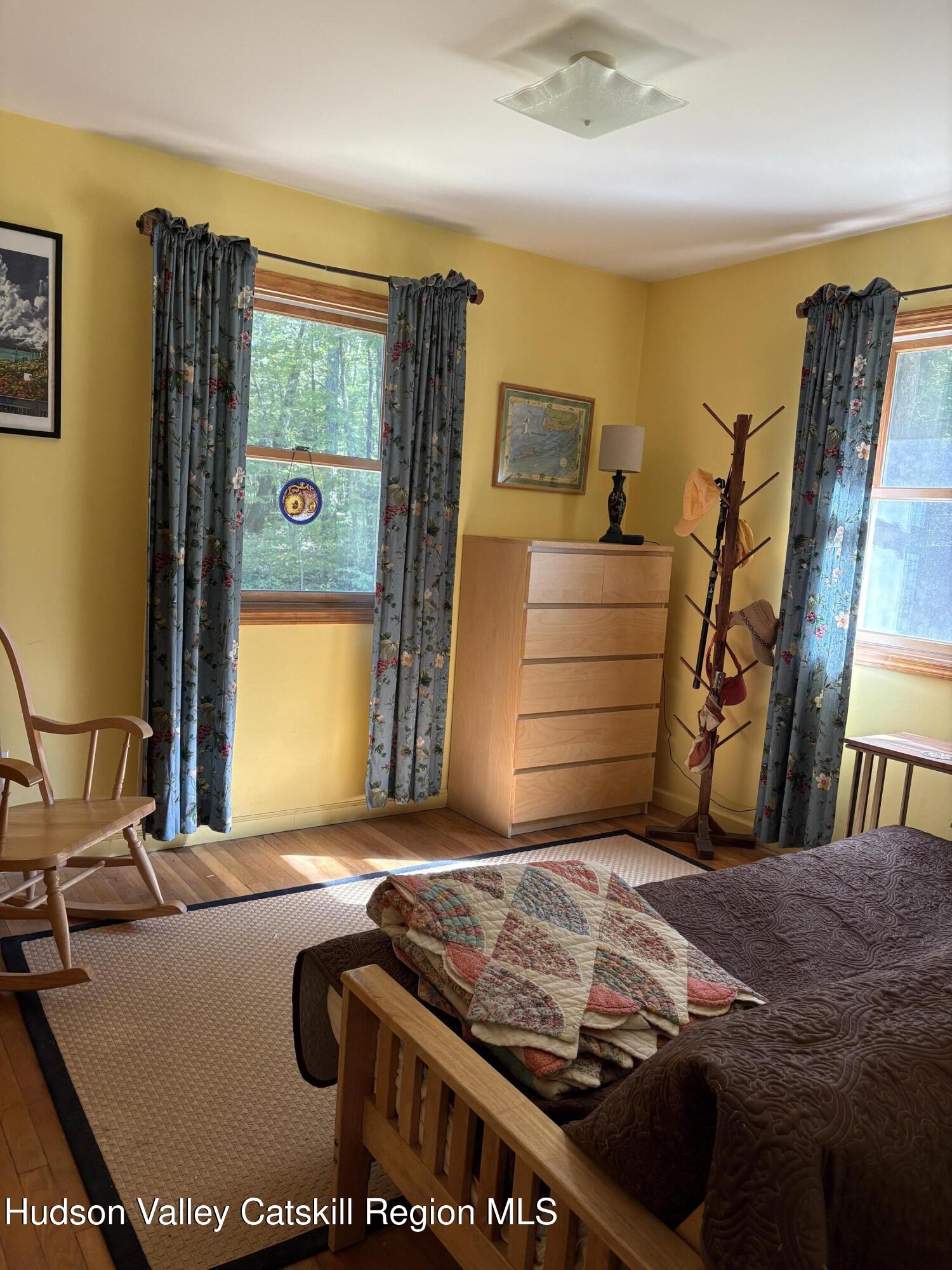 336 Ashley Hill Road Chatham, NY 12024 - Photo 15 of 27 a bed sitting in a room next to a window