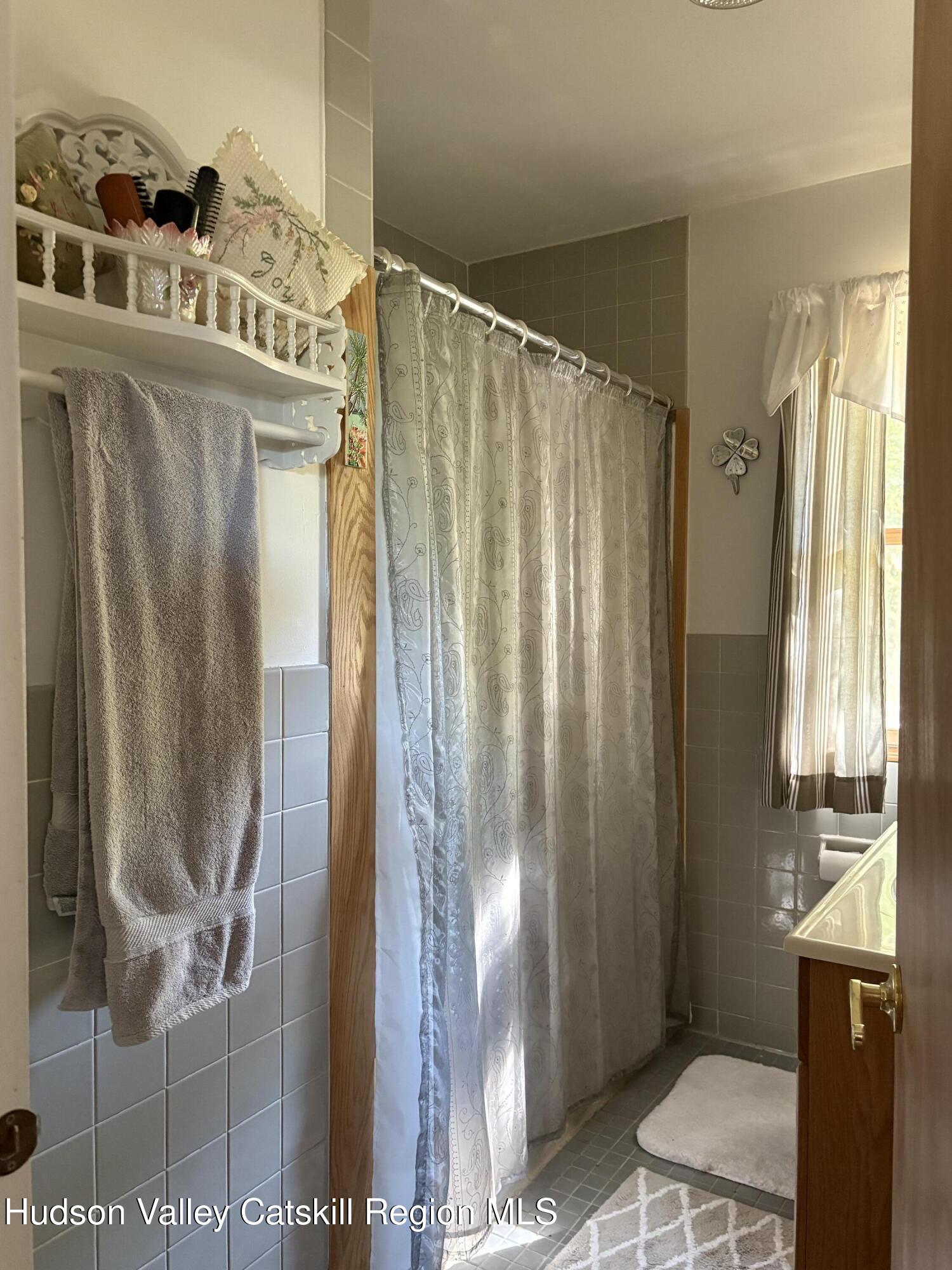 336 Ashley Hill Road Chatham, NY 12024 - Photo 17 of 27 a bathroom with a granite countertop shower and a sink