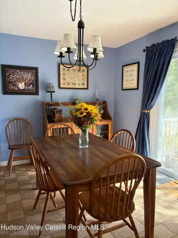 a kitchen with granite countertop a stove a microwave a sink and cabinets