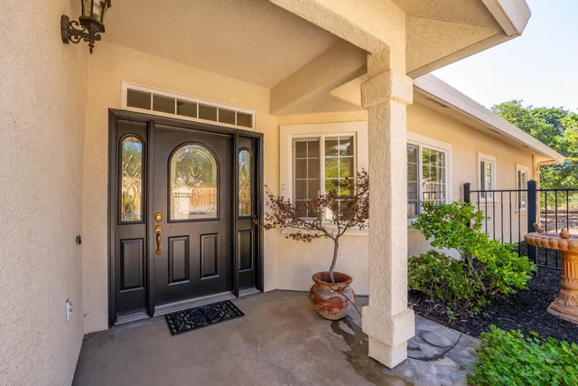 a front view of a house with garden