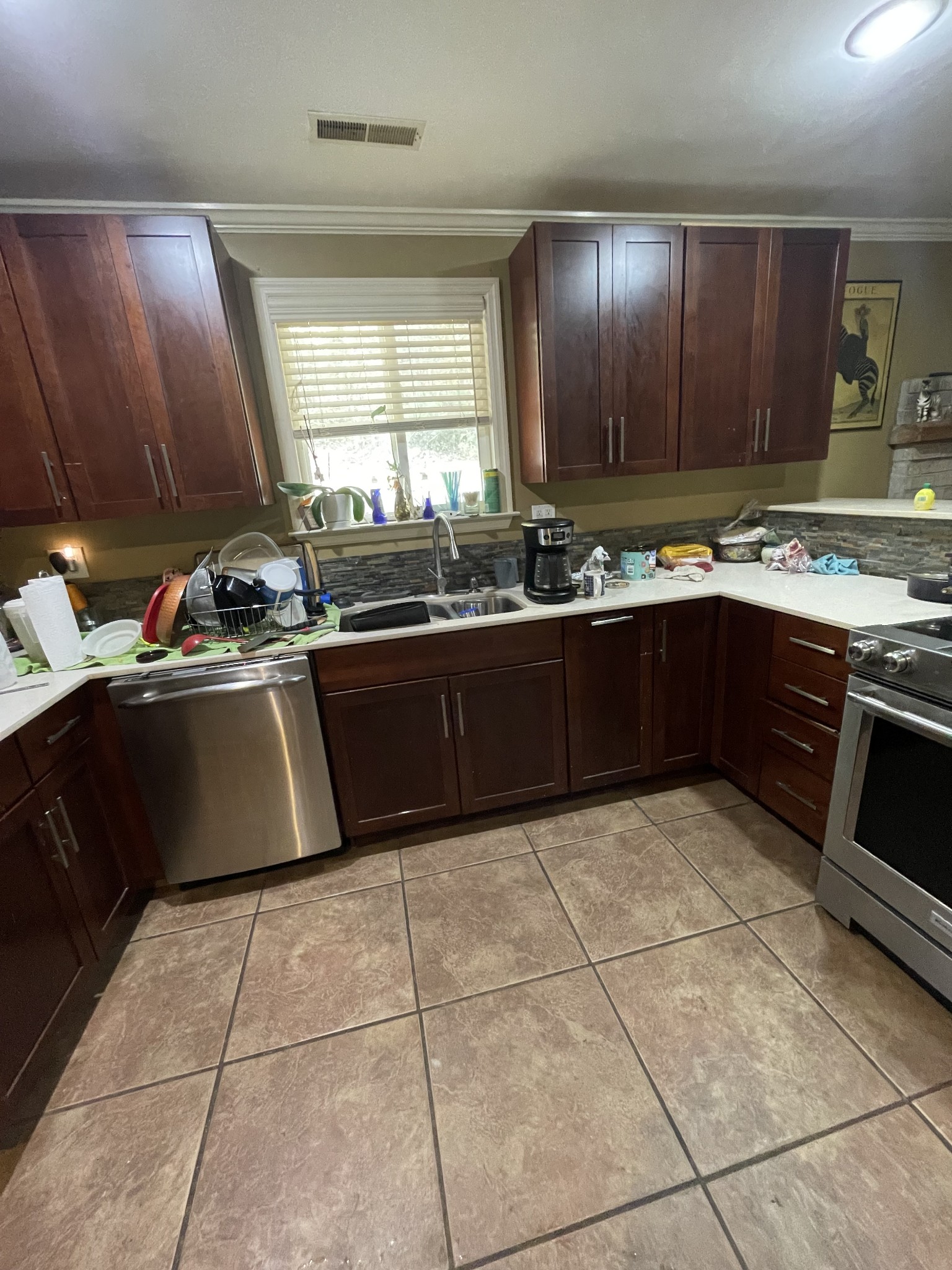 265 Harris Hollow Road Pleasant Shade, TN 37145 - Photo 2 of 15 a kitchen with a sink a stove top oven and cabinetry
